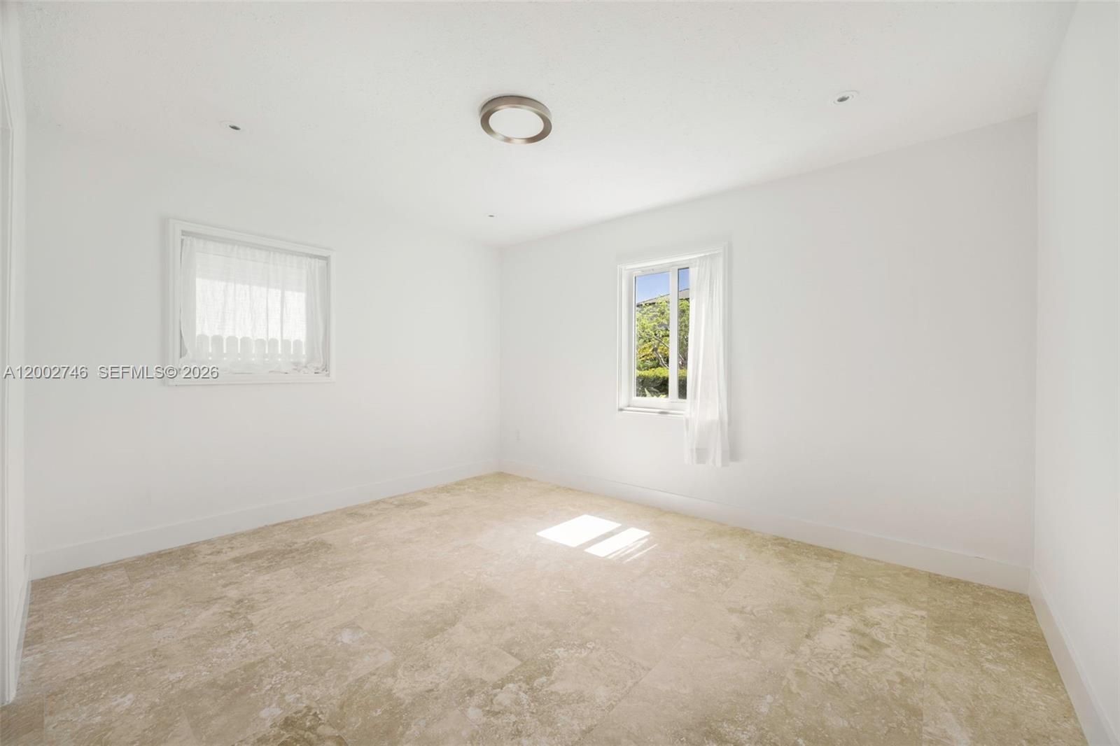 255 Ridgewood Road Key Biscayne, FL 33149 - Photo 14 of 30 an empty room with windows