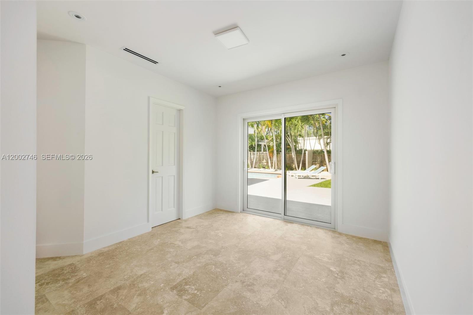 255 Ridgewood Road Key Biscayne, FL 33149 - Photo 15 of 30 a view of an empty room with a window