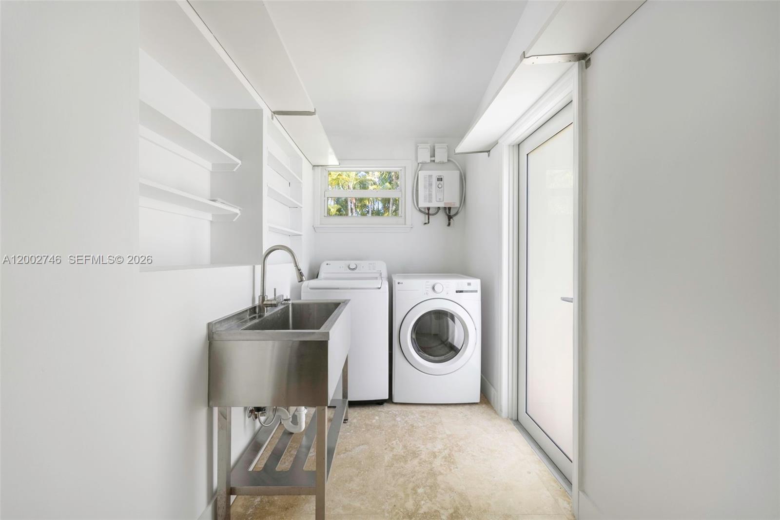 255 Ridgewood Road Key Biscayne, FL 33149 - Photo 24 of 30 a utility room with dryer and washer