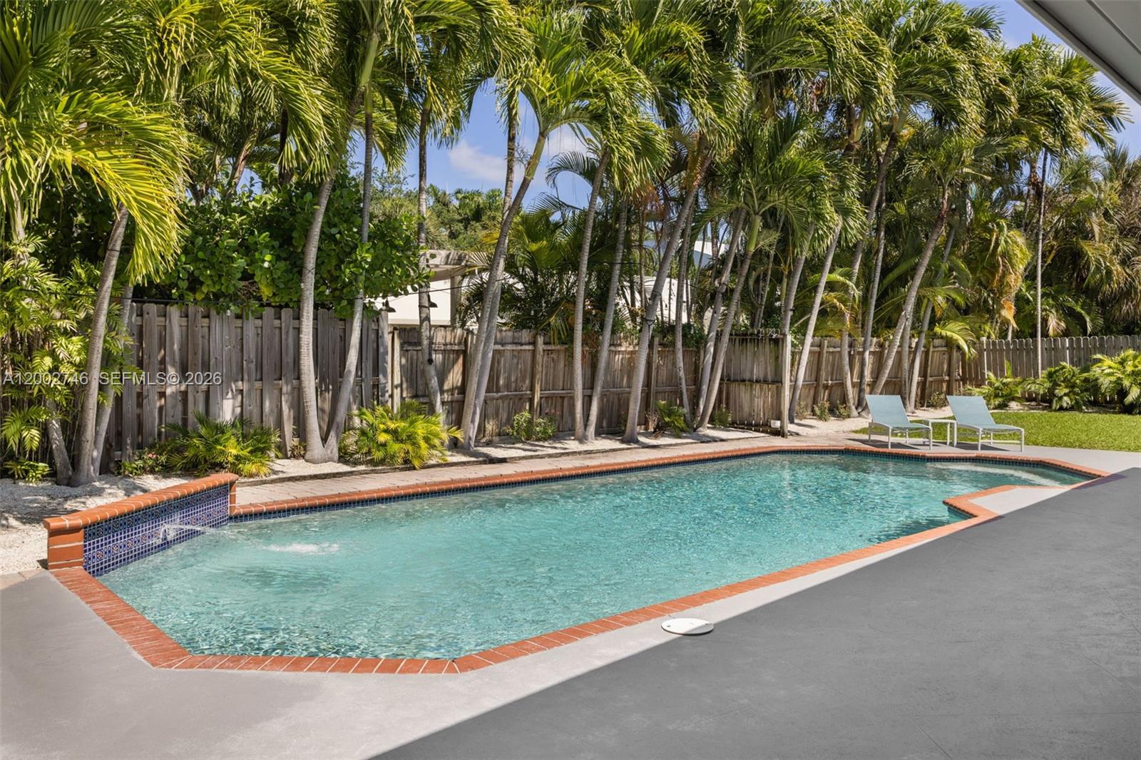 255 Ridgewood Road Key Biscayne, FL 33149 - Photo 25 of 30 a view of a backyard with swimming pool