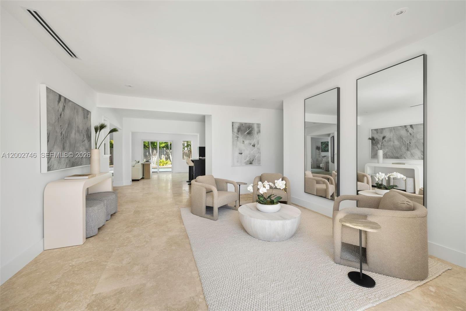 255 Ridgewood Road Key Biscayne, FL 33149 - Photo 3 of 30 a living room with furniture and a large window