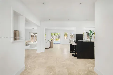 a view of a livingroom with furniture and a flat screen tv
