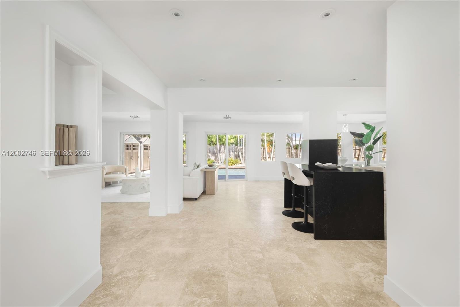 255 Ridgewood Road Key Biscayne, FL 33149 - Photo 5 of 30 a view of a livingroom with furniture and a flat screen tv