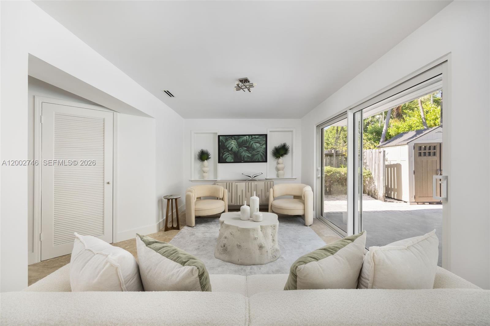 255 Ridgewood Road Key Biscayne, FL 33149 - Photo 9 of 30 a living room with furniture and a large window