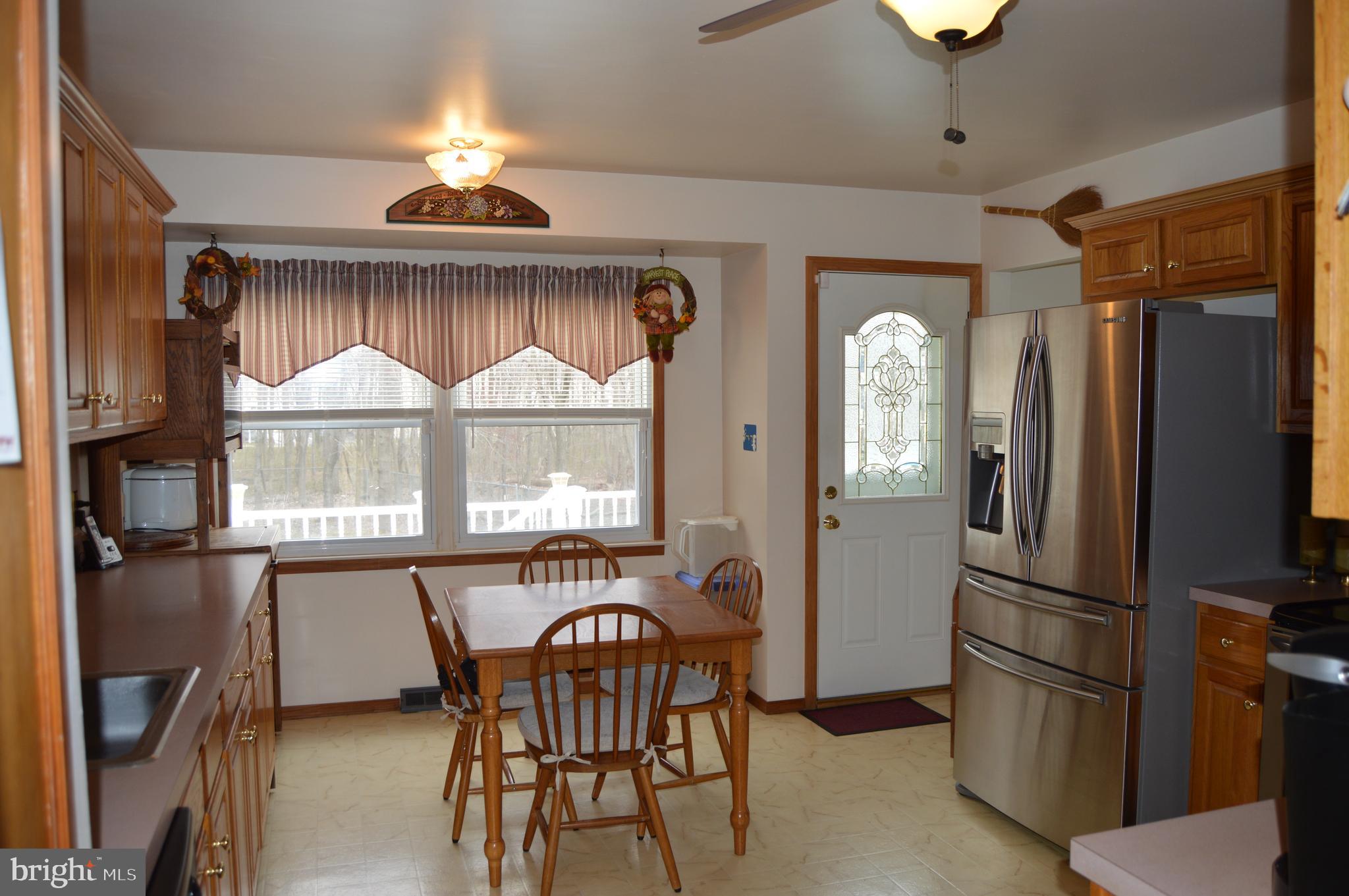 8315 Jacobs Road Severn, MD 21144 - Photo 11 of 37 Natural Light Looking Over the Deck and Pool