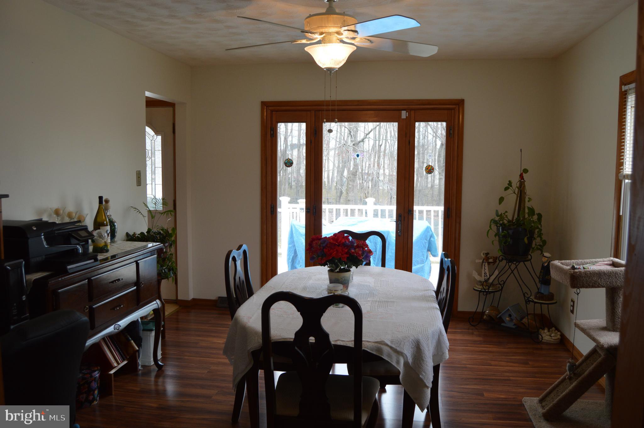 8315 Jacobs Road Severn, MD 21144 - Photo 12 of 37 Separate Dining Room Over Looking the Deck and Poo