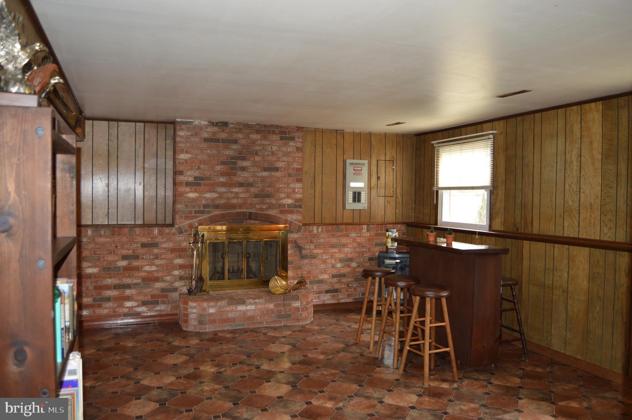 8315 Jacobs Road Severn, MD 21144 - Photo 26 of 37 Family Room with a Bar and Fire Place