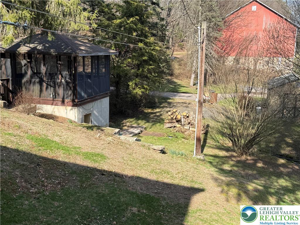 1227 Valley Road Tamaqua, PA 18252 - Photo 4 of 47 a view of a yard with a tree