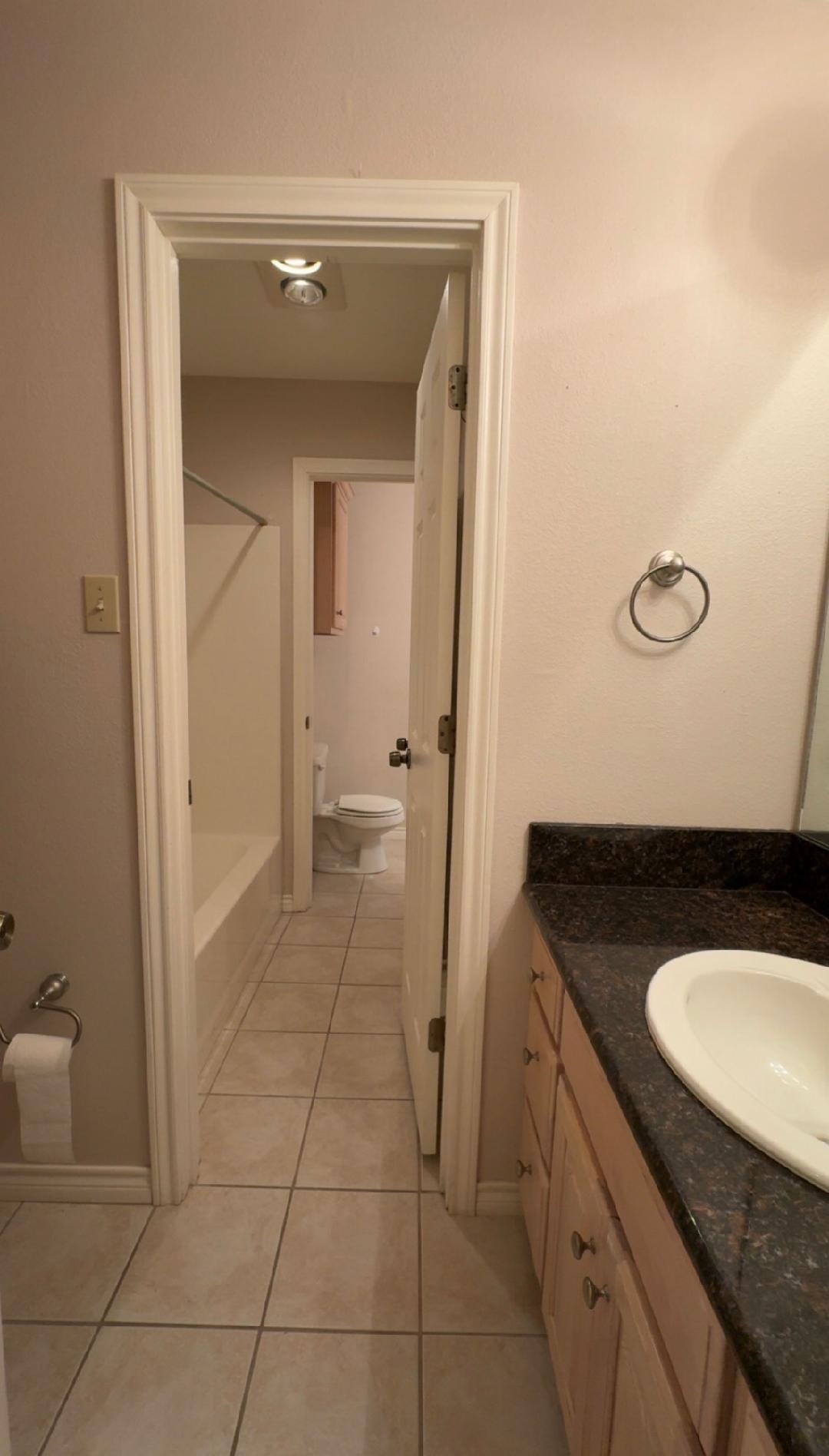 4665 Glen Oaks Circle Beaumont, TX 77708 - Photo 15 of 20 a bathroom with a granite countertop sink and a mirror