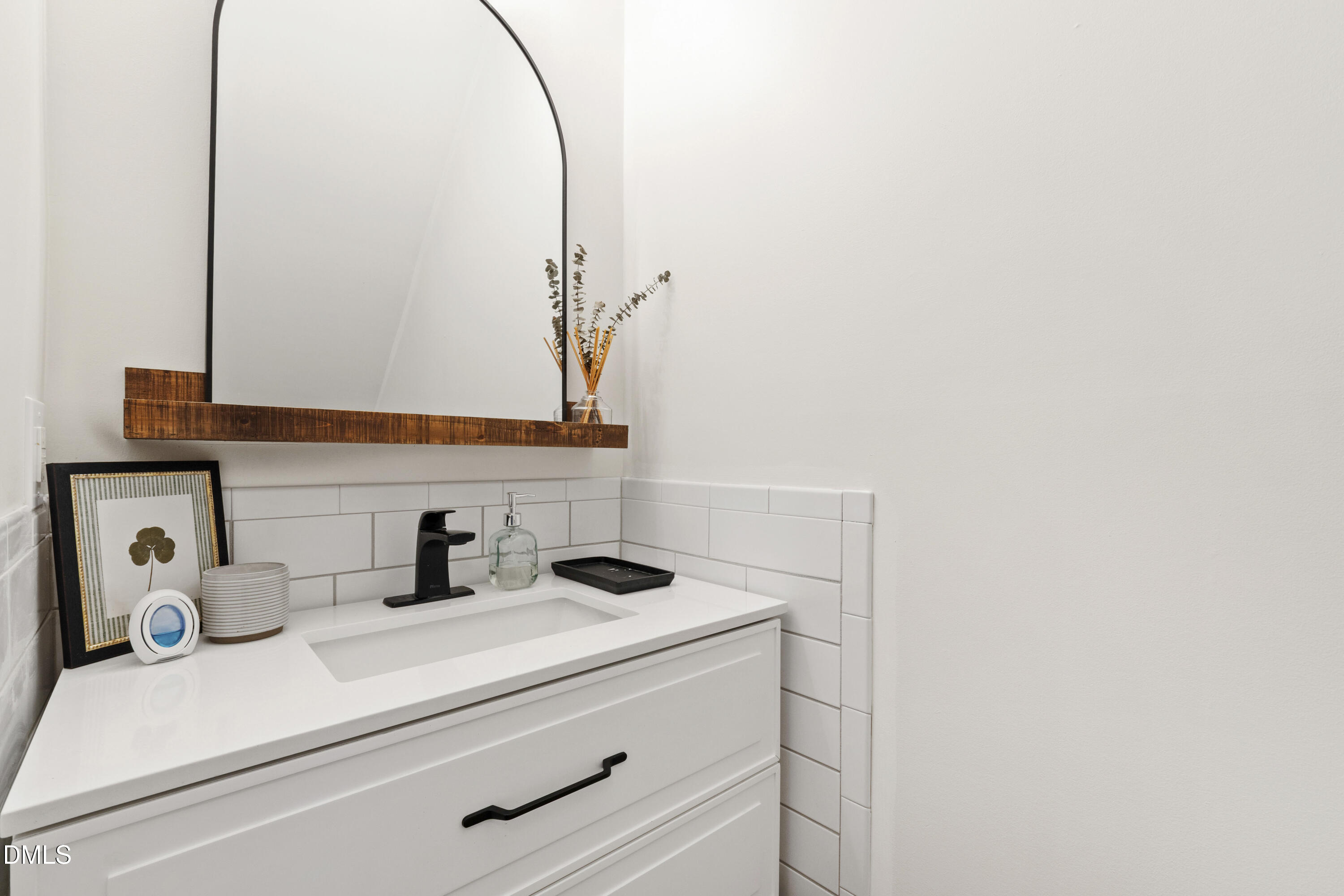 7501 Panther Branch Drive Raleigh, NC 27612 - Photo 10 of 56 a bathroom with a sink and a mirror