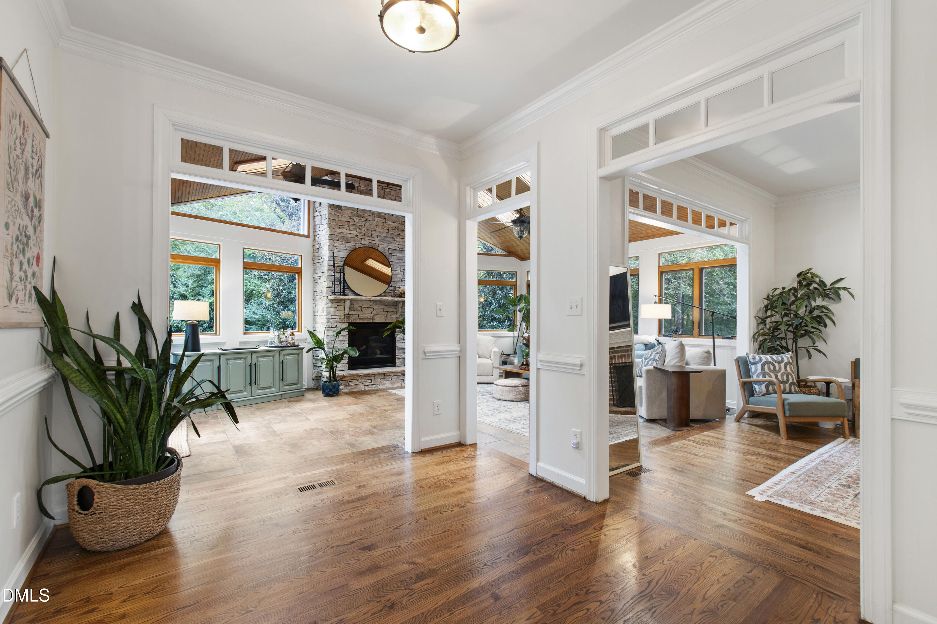 7501 Panther Branch Drive Raleigh, NC 27612 - Photo 11 of 56 a living room with furniture potted plant floor to ceiling window and potted plant