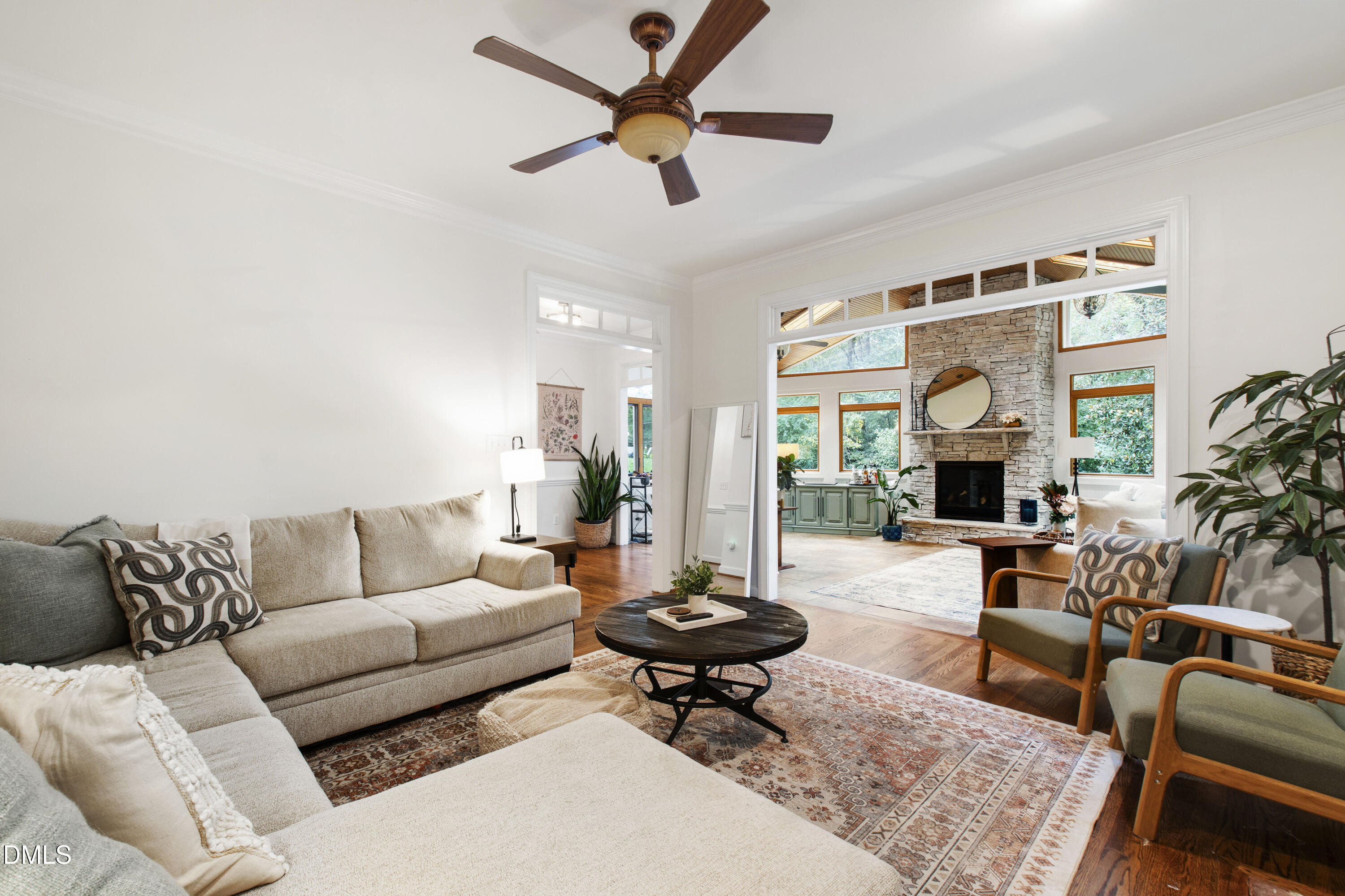 7501 Panther Branch Drive Raleigh, NC 27612 - Photo 14 of 56 a living room with furniture a fireplace and a large window