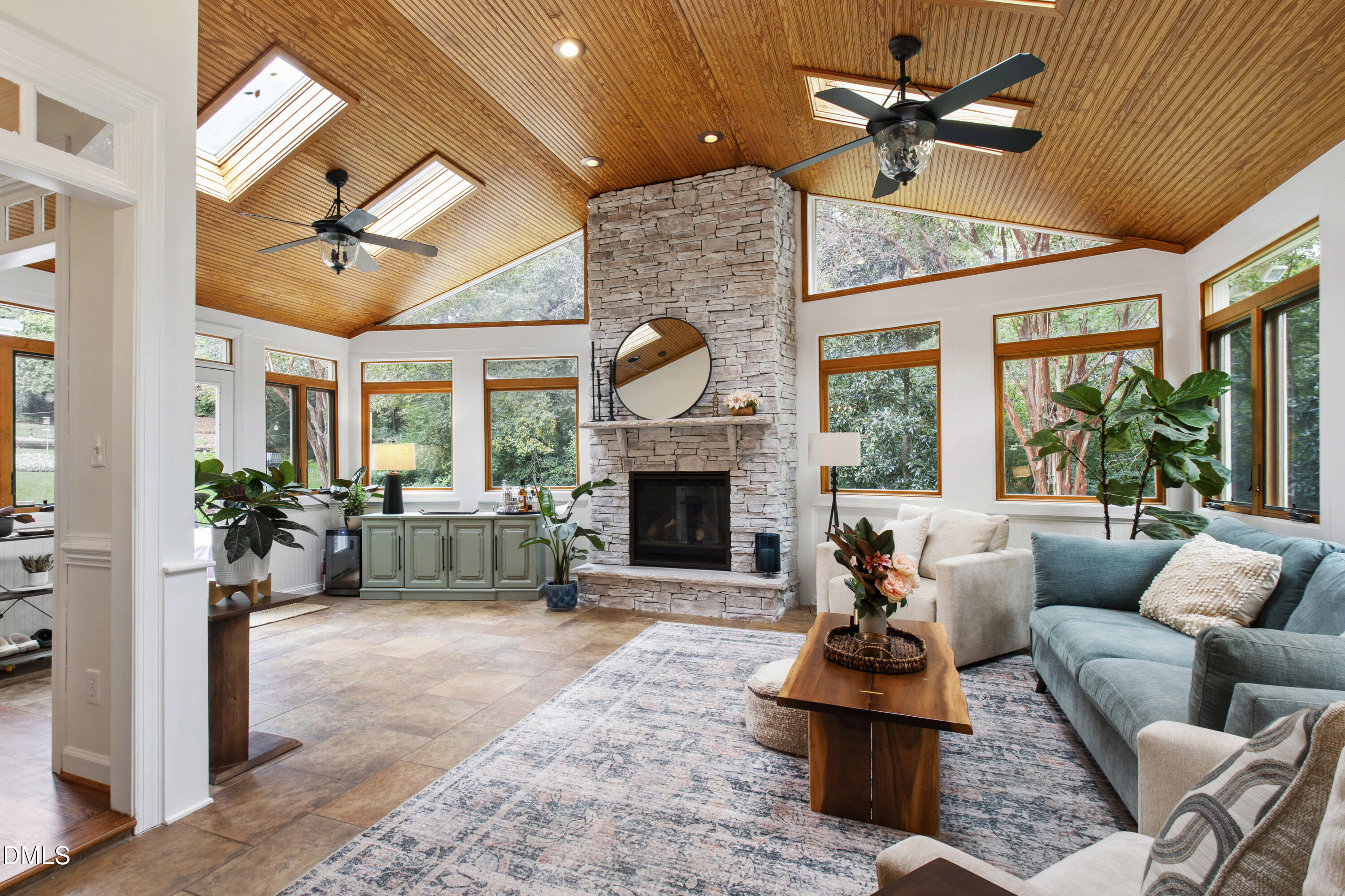 7501 Panther Branch Drive Raleigh, NC 27612 - Photo 15 of 56 a living room with furniture a fireplace and a flat screen tv