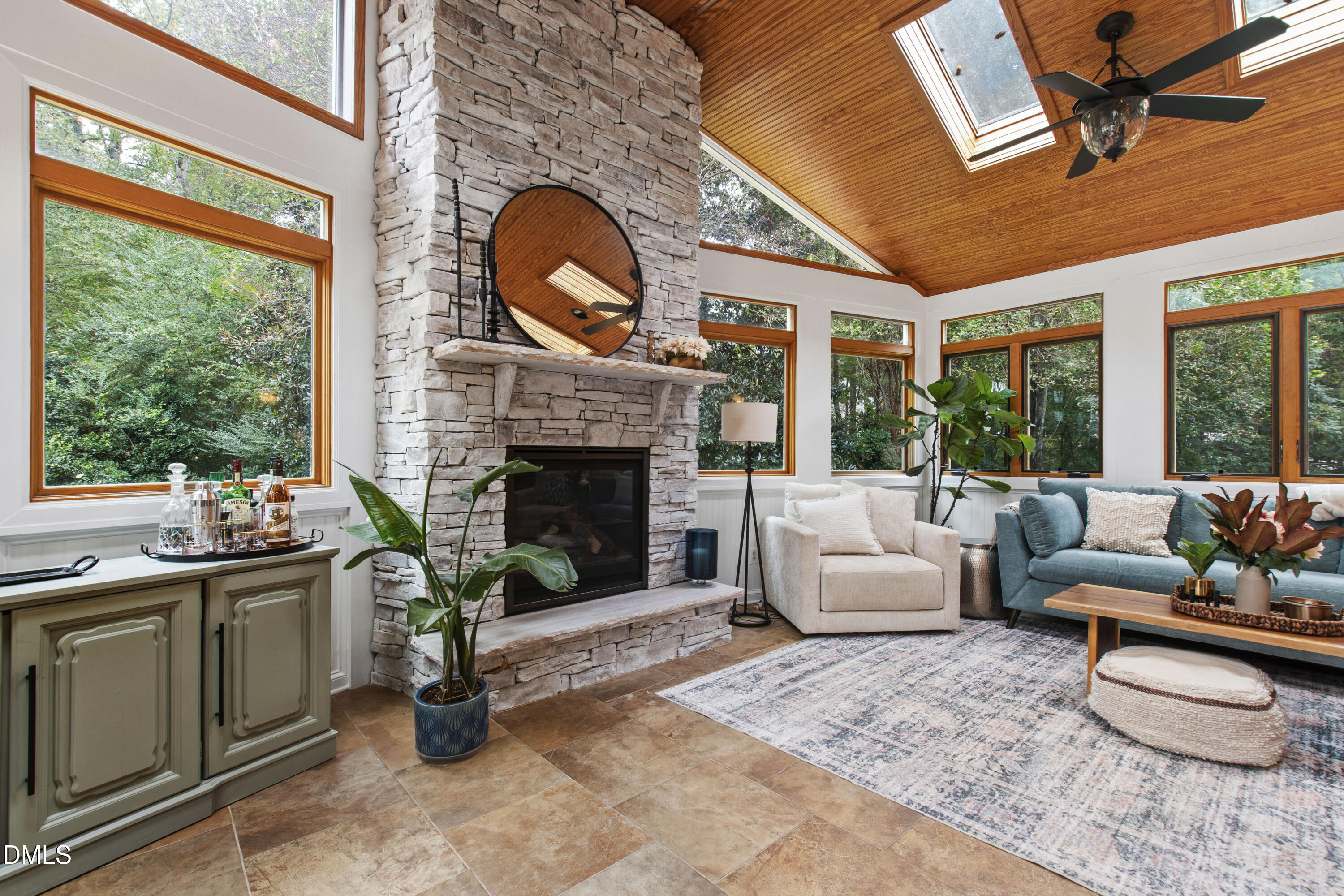 7501 Panther Branch Drive Raleigh, NC 27612 - Photo 17 of 56 a living room with furniture a window and a fireplace