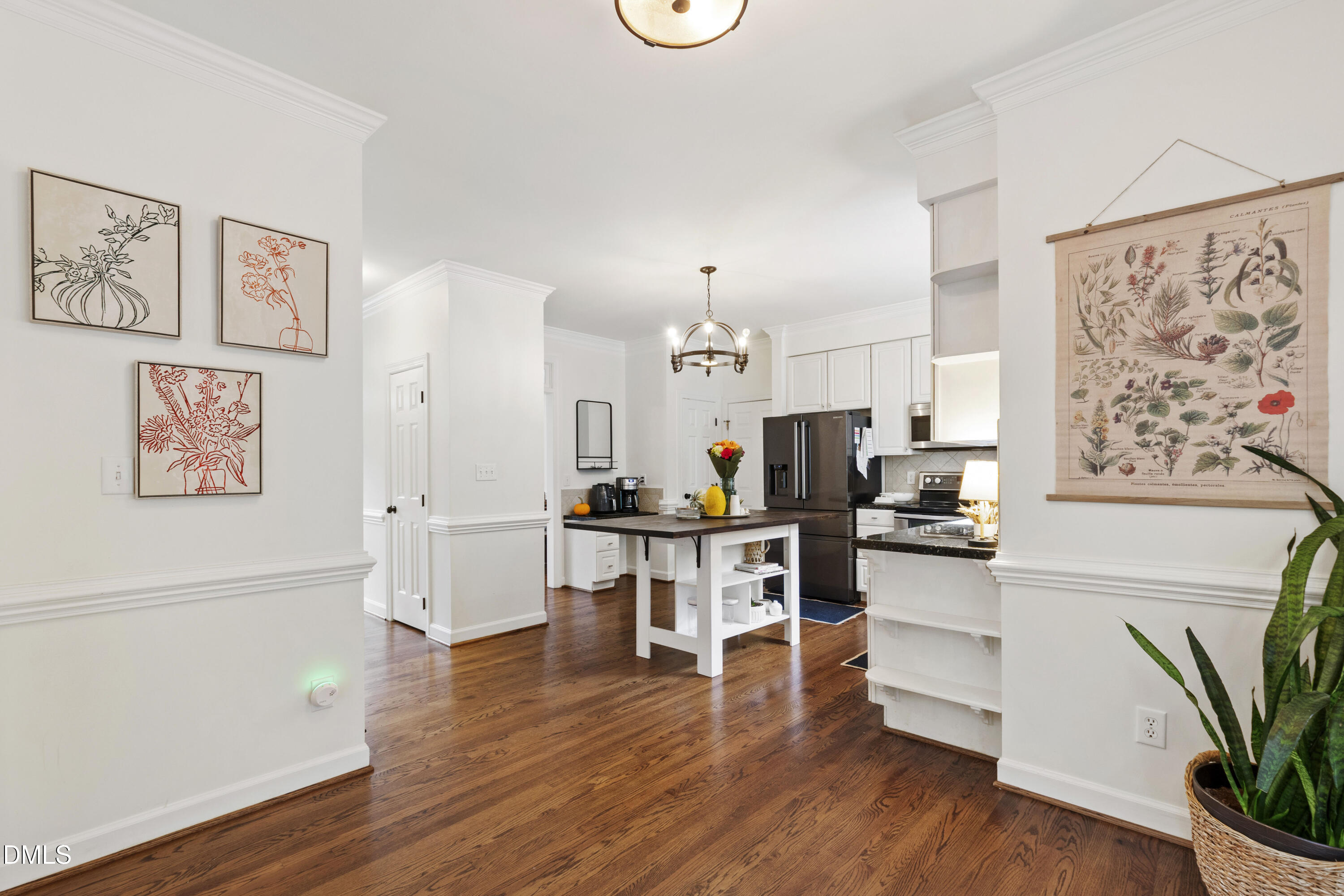 7501 Panther Branch Drive Raleigh, NC 27612 - Photo 20 of 56 a view of kitchen with cabinets and wooden floor