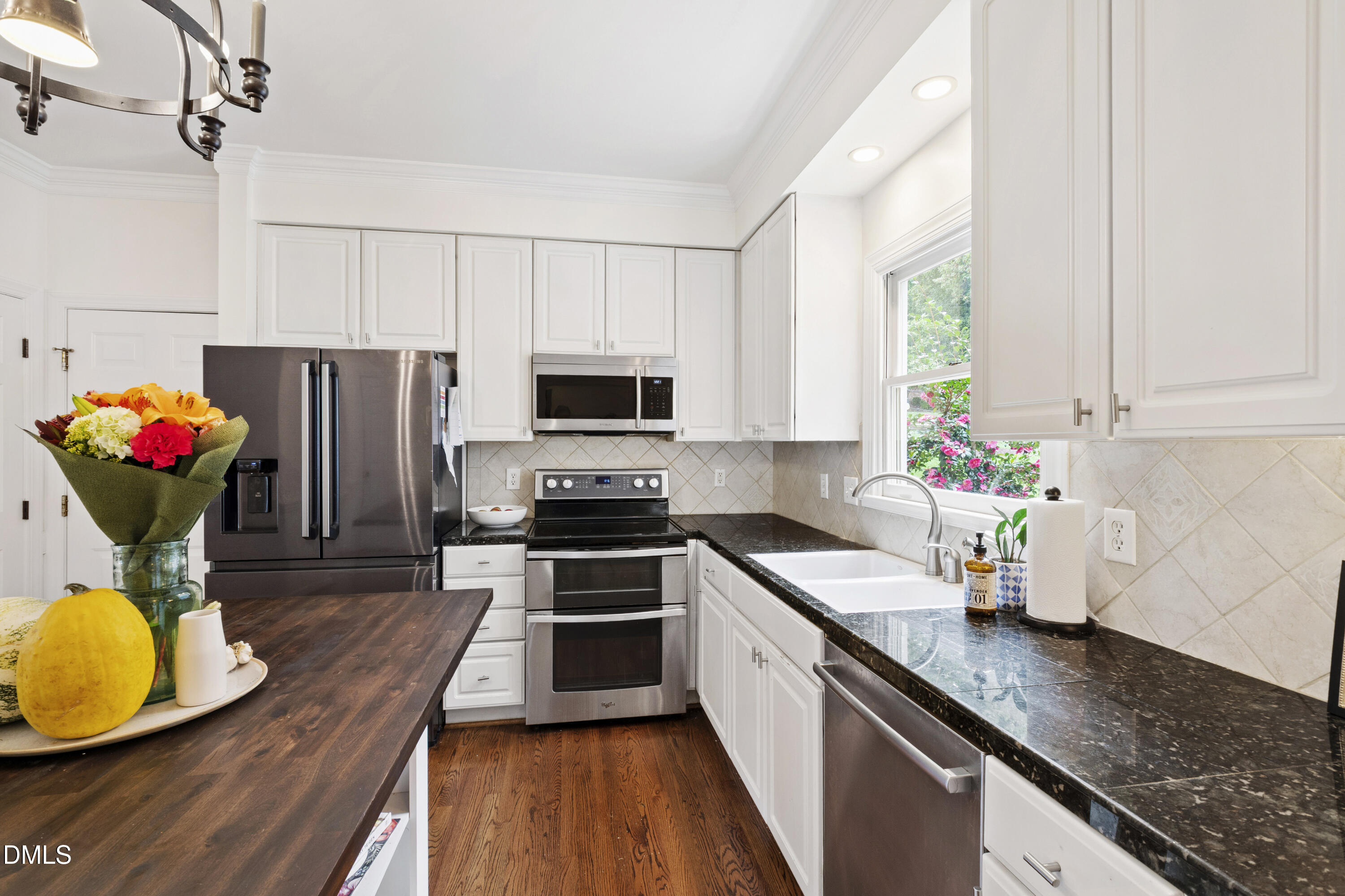7501 Panther Branch Drive Raleigh, NC 27612 - Photo 26 of 56 a kitchen with stainless steel appliances granite countertop wooden cabinets a stove a sink and dishwasher