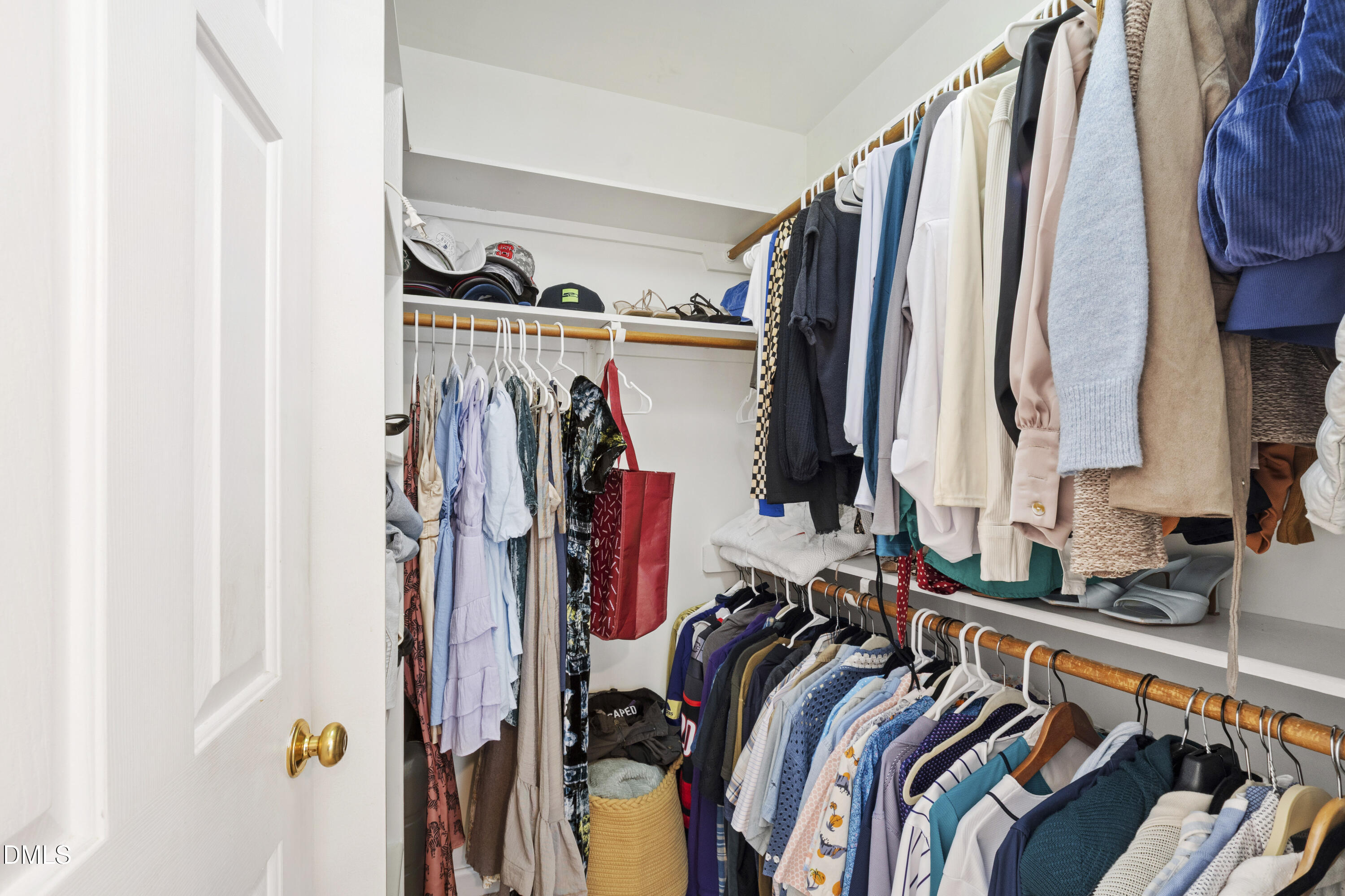 7501 Panther Branch Drive Raleigh, NC 27612 - Photo 33 of 56 a view of walk in closet with clothes and shoes