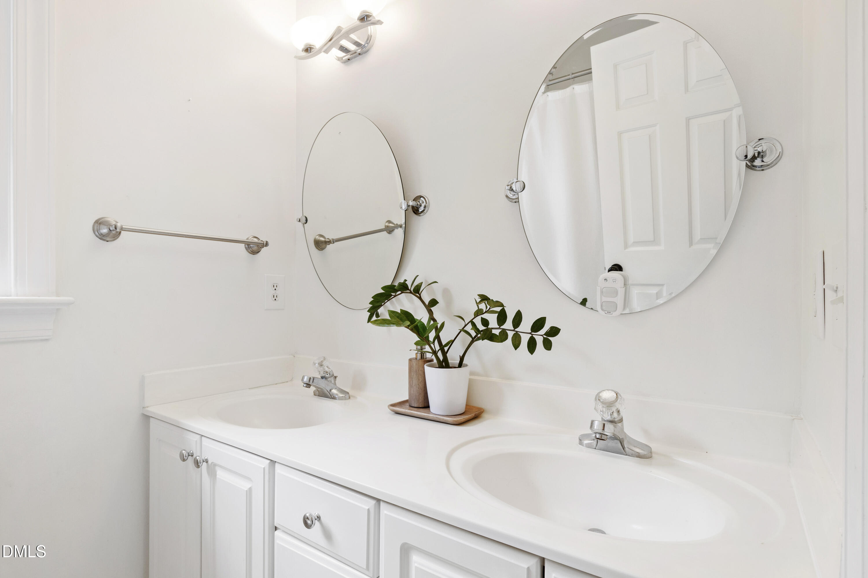 7501 Panther Branch Drive Raleigh, NC 27612 - Photo 35 of 56 a bathroom with a sink and a mirror