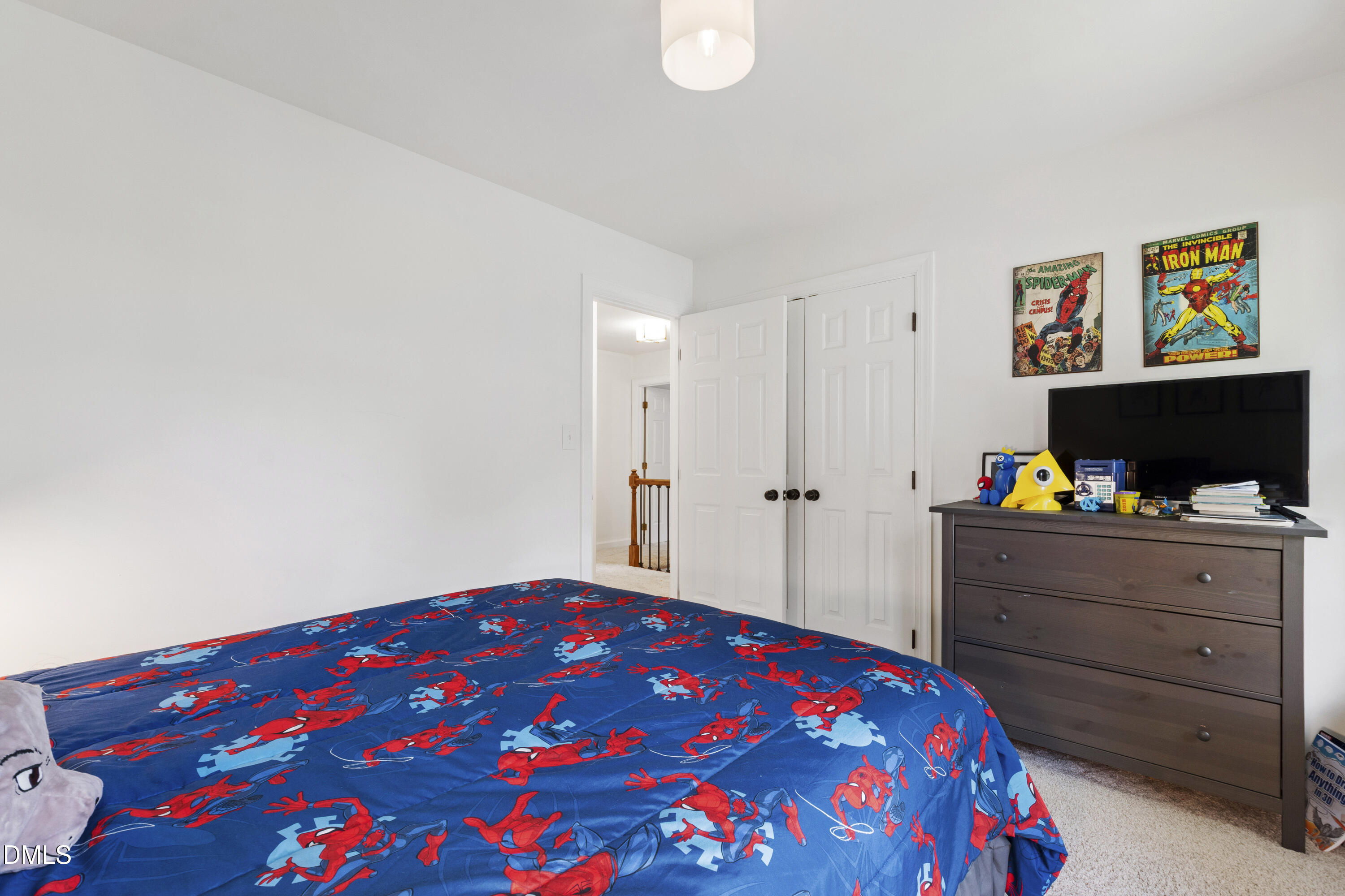 7501 Panther Branch Drive Raleigh, NC 27612 - Photo 38 of 56 a bedroom with a bed and a flat screen tv