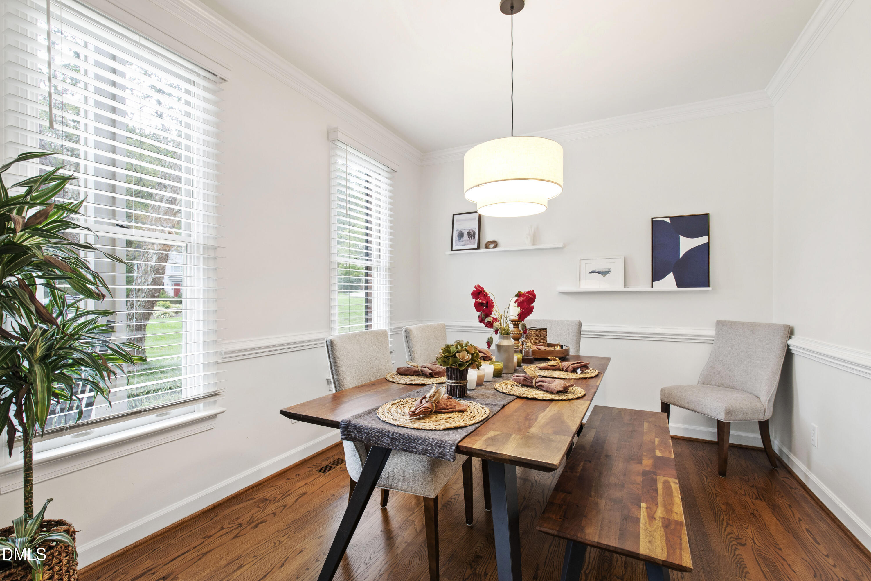 7501 Panther Branch Drive Raleigh, NC 27612 - Photo 3 of 56 a view of a dining room with furniture window and wooden floor