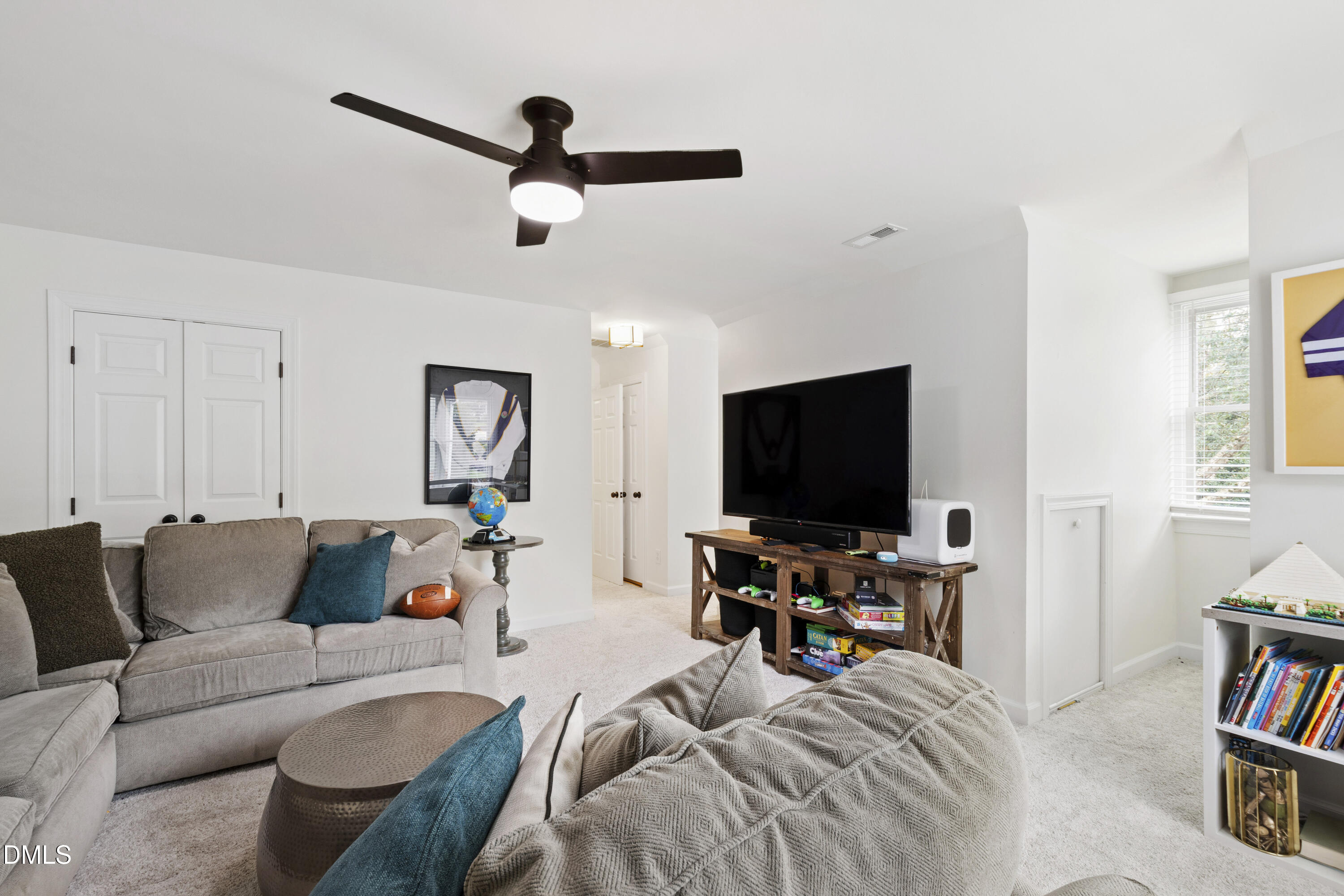 7501 Panther Branch Drive Raleigh, NC 27612 - Photo 42 of 56 a bedroom with furniture and a flat screen tv