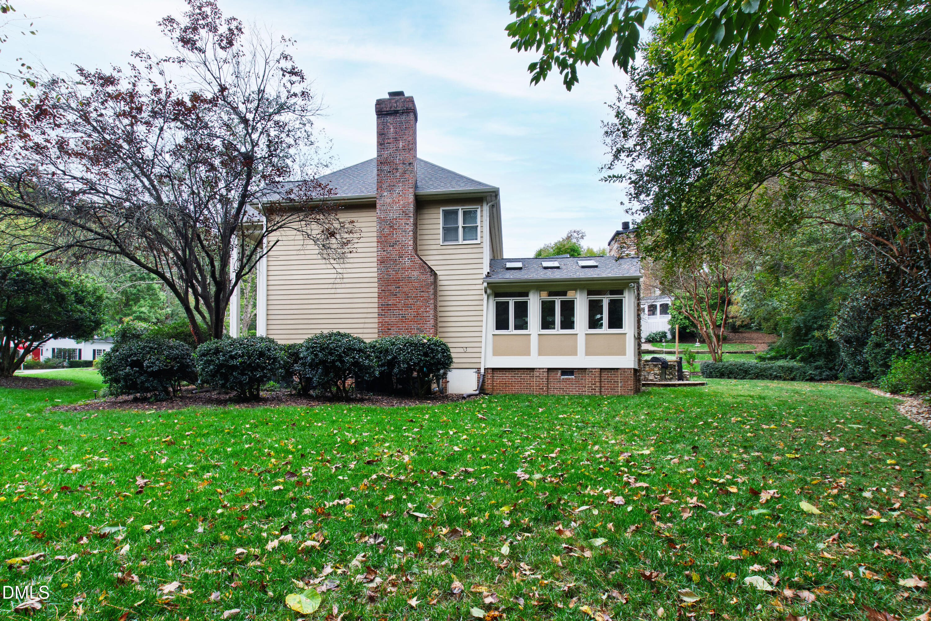 7501 Panther Branch Drive Raleigh, NC 27612 - Photo 48 of 56 a front view of a house with a garden