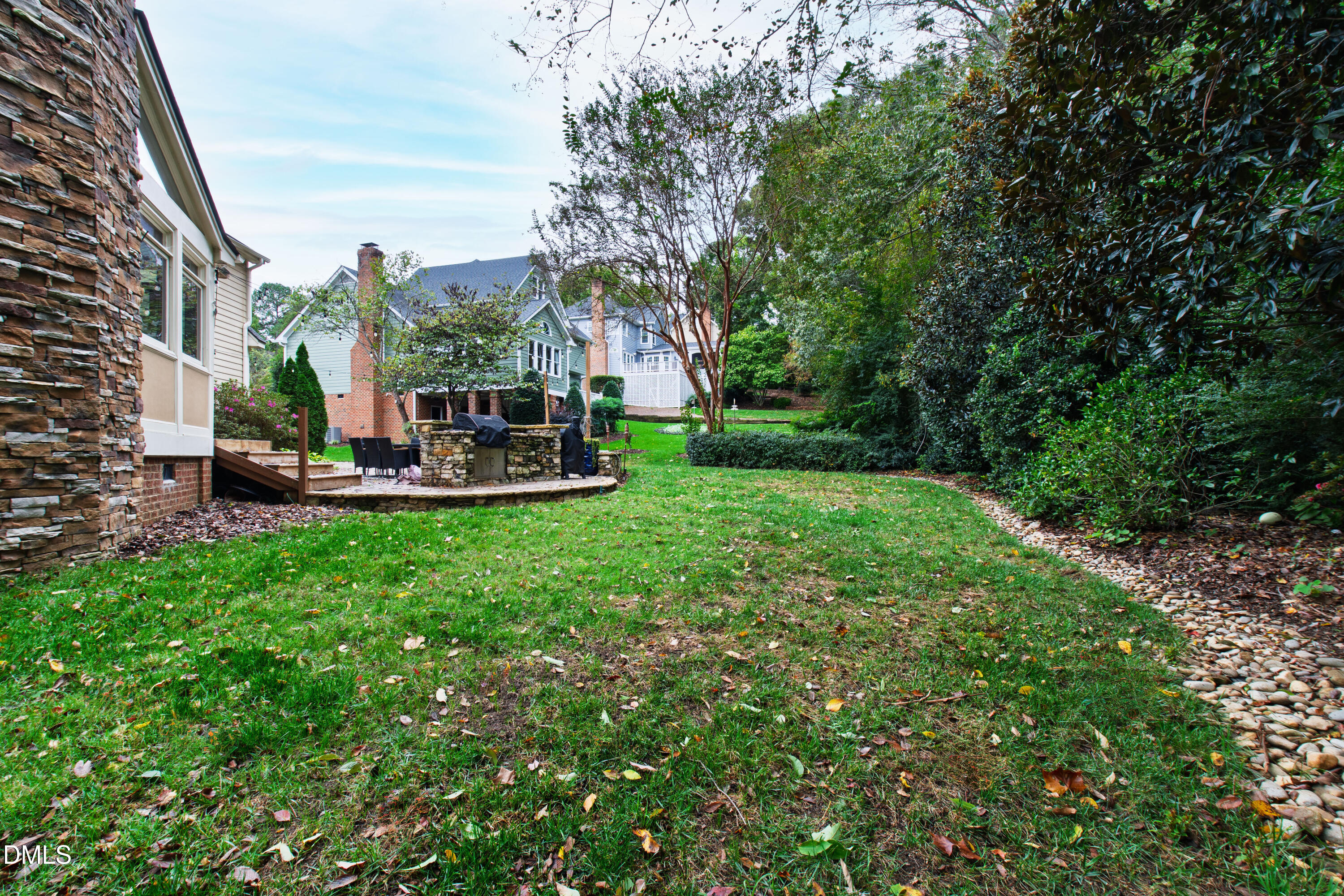 7501 Panther Branch Drive Raleigh, NC 27612 - Photo 49 of 56 a view of a house with a big yard potted plants and large tree