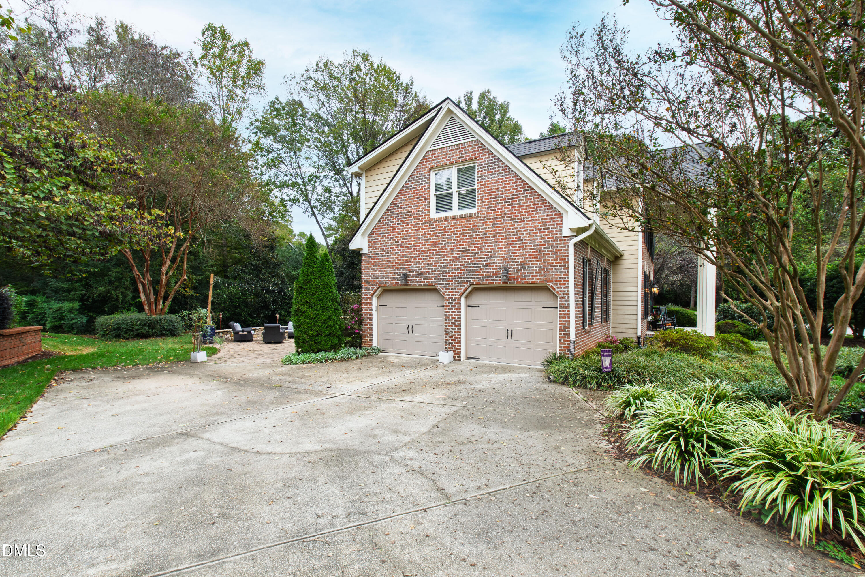 7501 Panther Branch Drive Raleigh, NC 27612 - Photo 51 of 56 a front view of a house with a yard and garage
