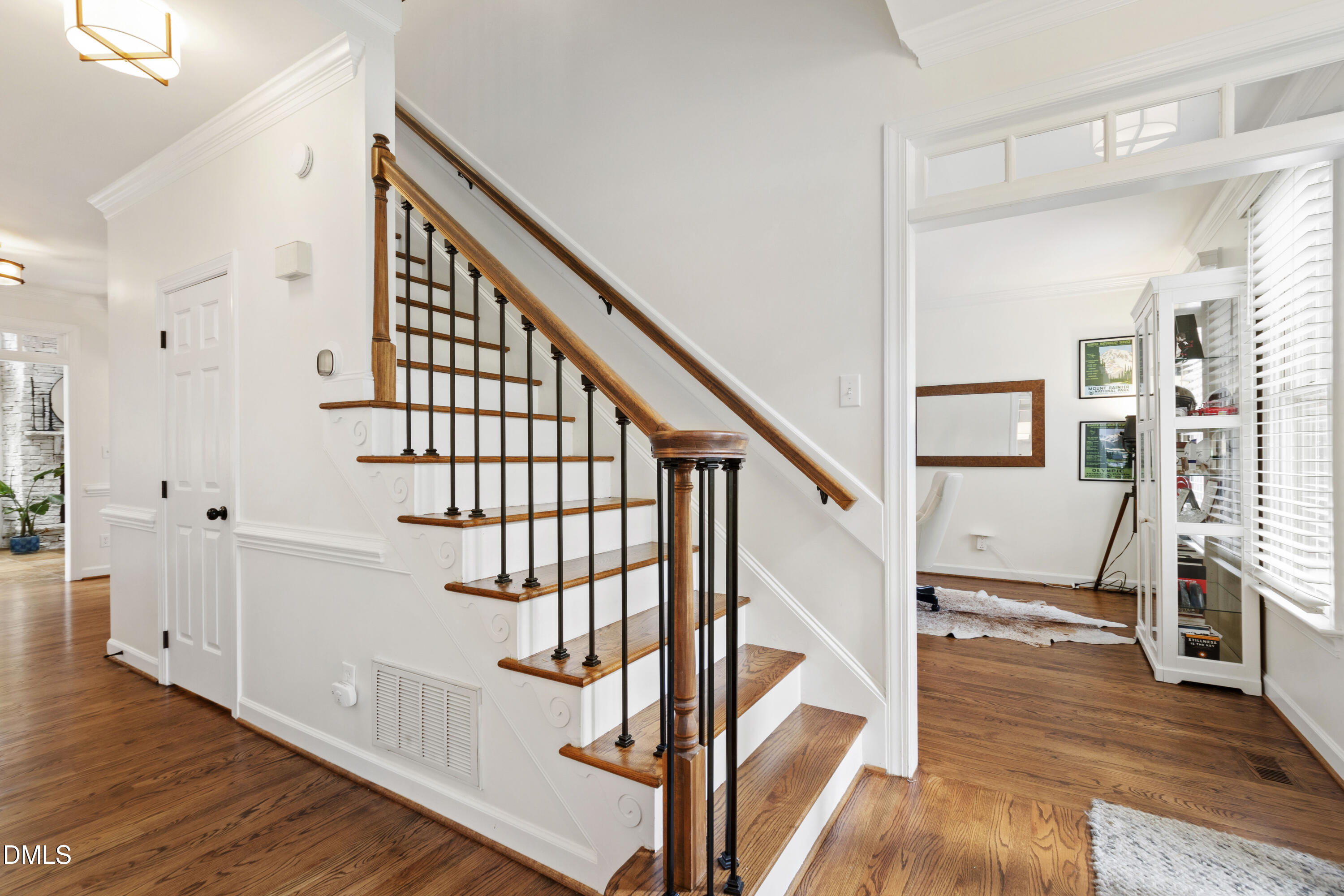 7501 Panther Branch Drive Raleigh, NC 27612 - Photo 5 of 56 a view of entryway and hall with wooden floor
