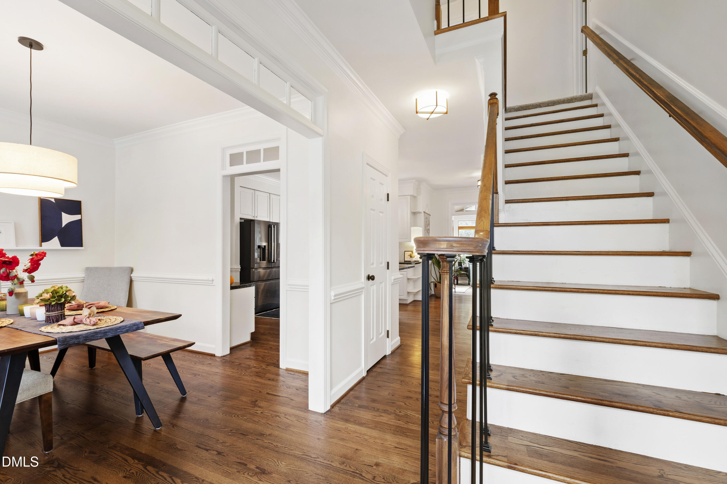 7501 Panther Branch Drive Raleigh, NC 27612 - Photo 6 of 56 a view of entryway and hall with wooden floor