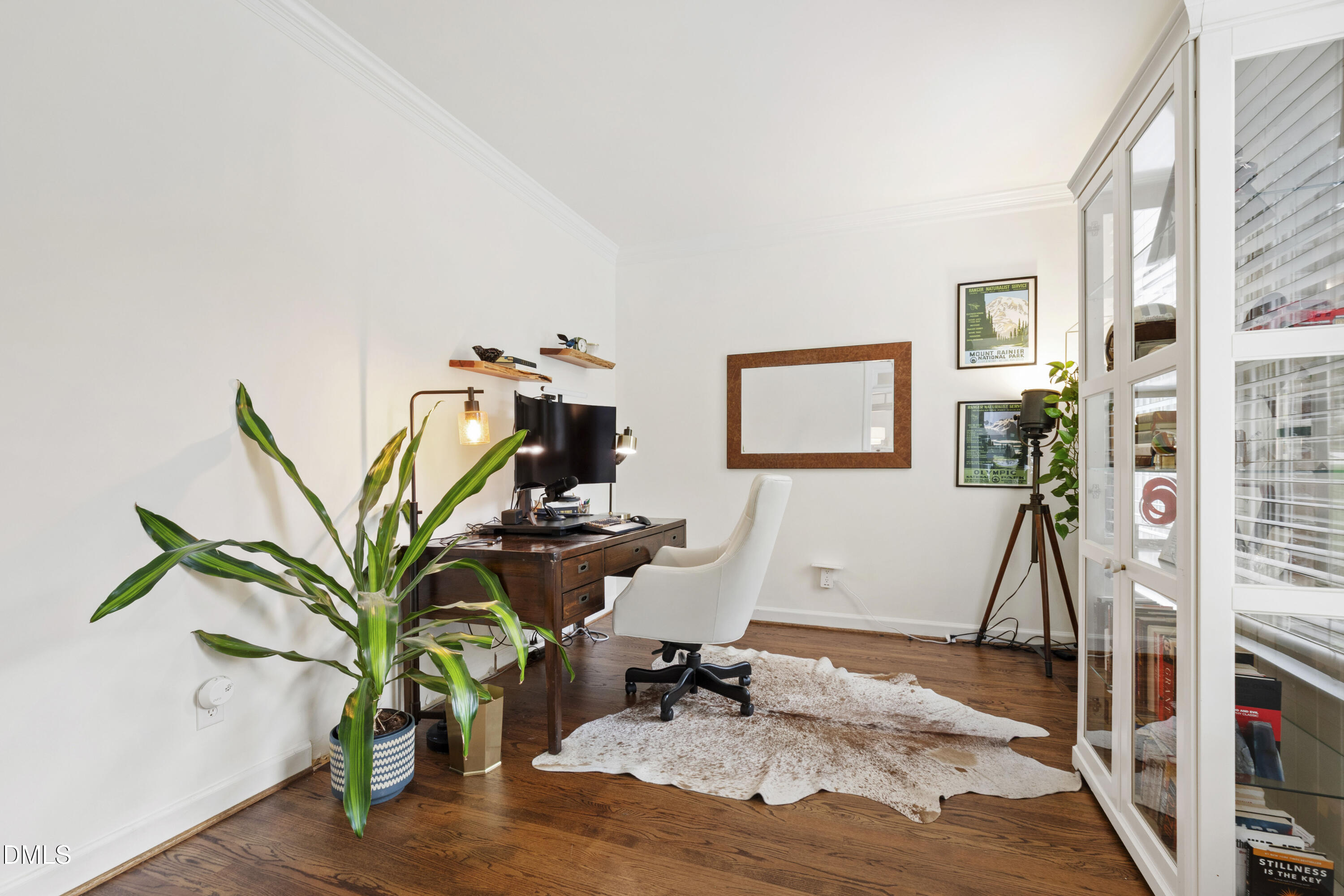 7501 Panther Branch Drive Raleigh, NC 27612 - Photo 7 of 56 a living room with furniture a potted plant and a book shelf