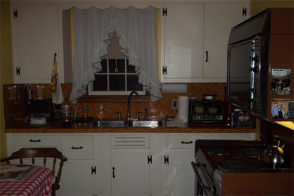 111 Goodwin Street Springfield, MA 01151 - Photo 2 of 19 a kitchen with stainless steel appliances granite countertop a stove a sink and a microwave