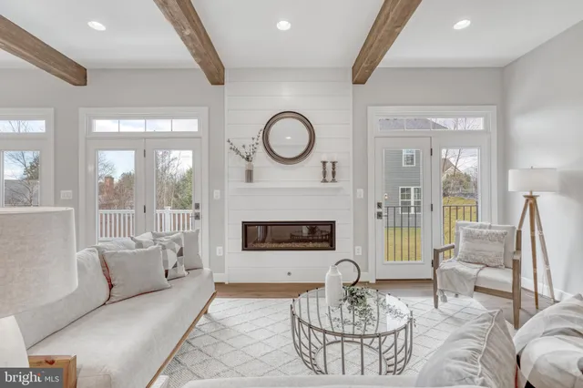 a view of a livingroom with wooden floor and closet area
