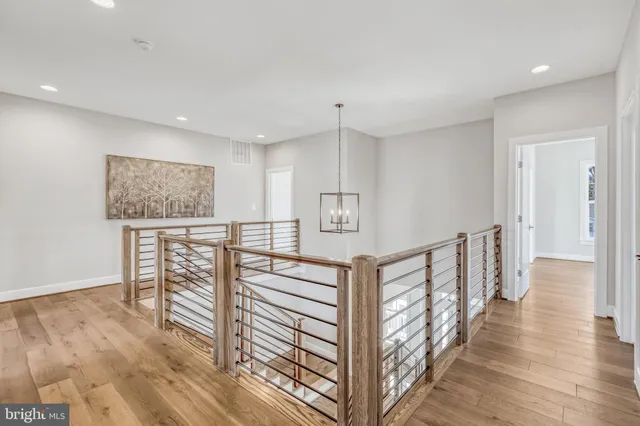 a spacious bathroom with a bathtub shower sink mirror and toilet