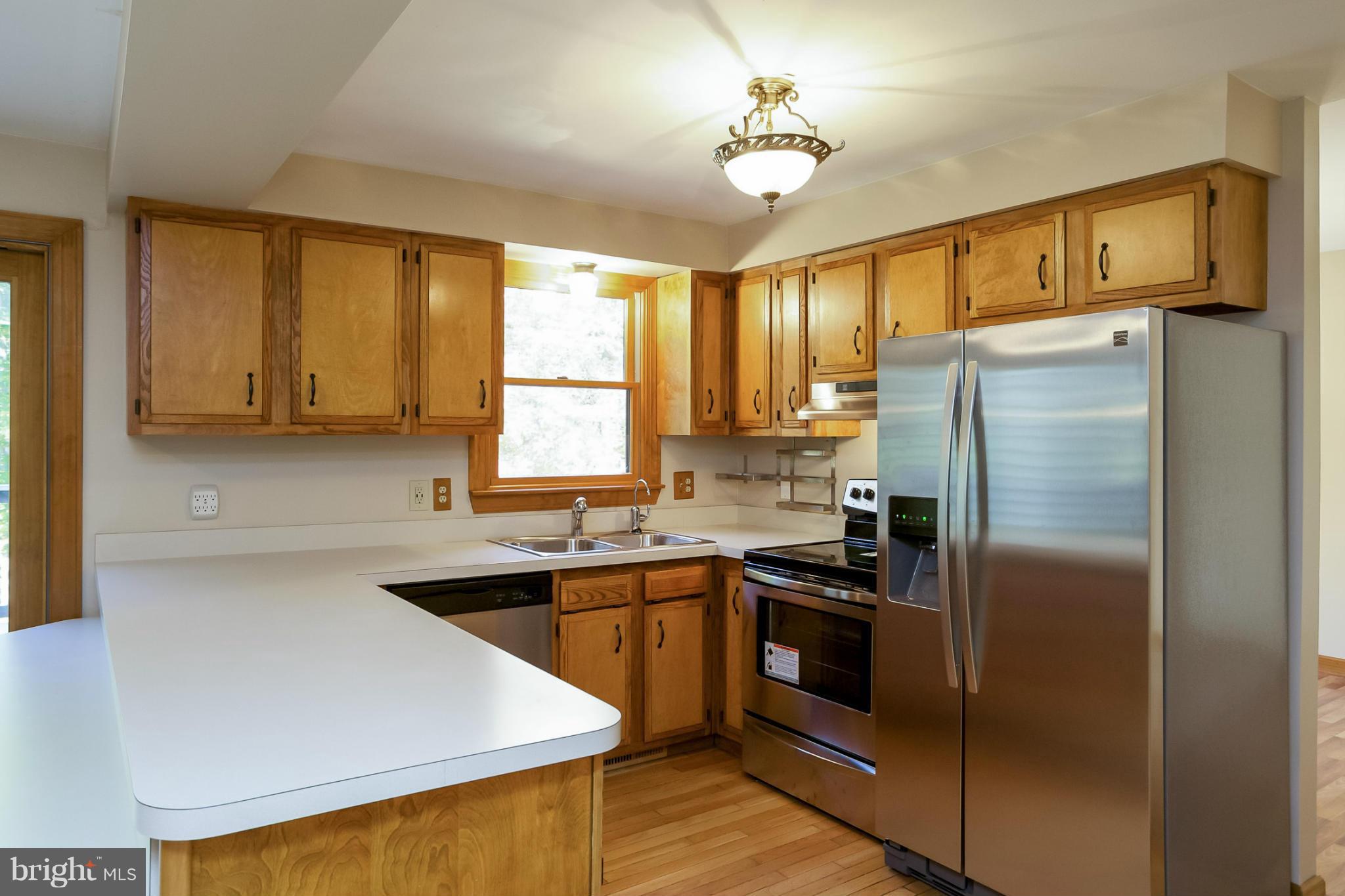 4371 Telegraph Road Elkton, MD 21921 - Photo 14 of 30 a kitchen with stainless steel appliances a refrigerator sink and cabinets