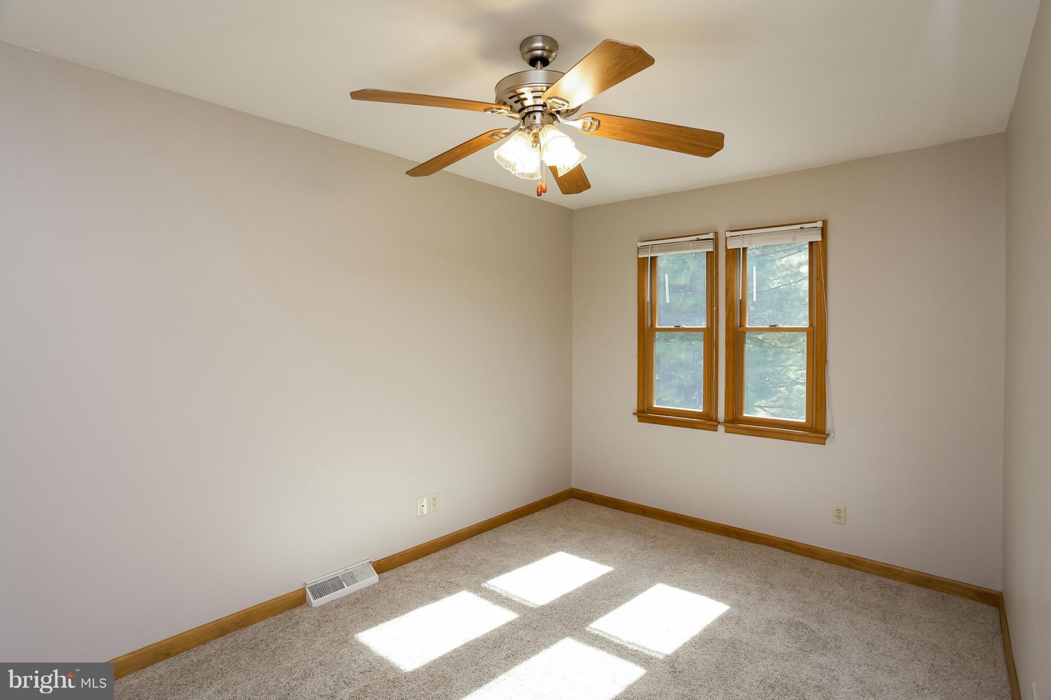 4371 Telegraph Road Elkton, MD 21921 - Photo 17 of 30 an empty room with windows and fan