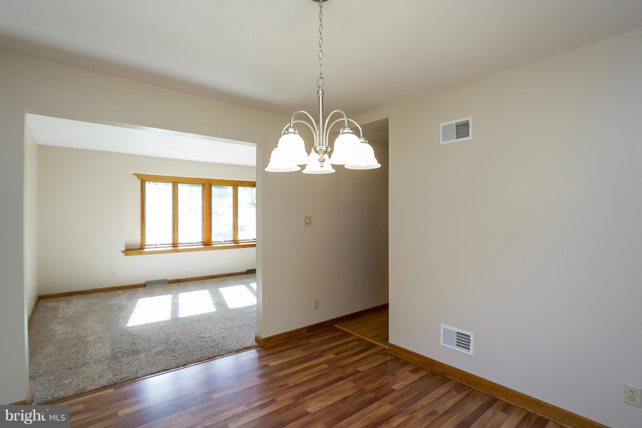 4371 Telegraph Road Elkton, MD 21921 - Photo 7 of 30 a view of an empty room with wooden floor and a window