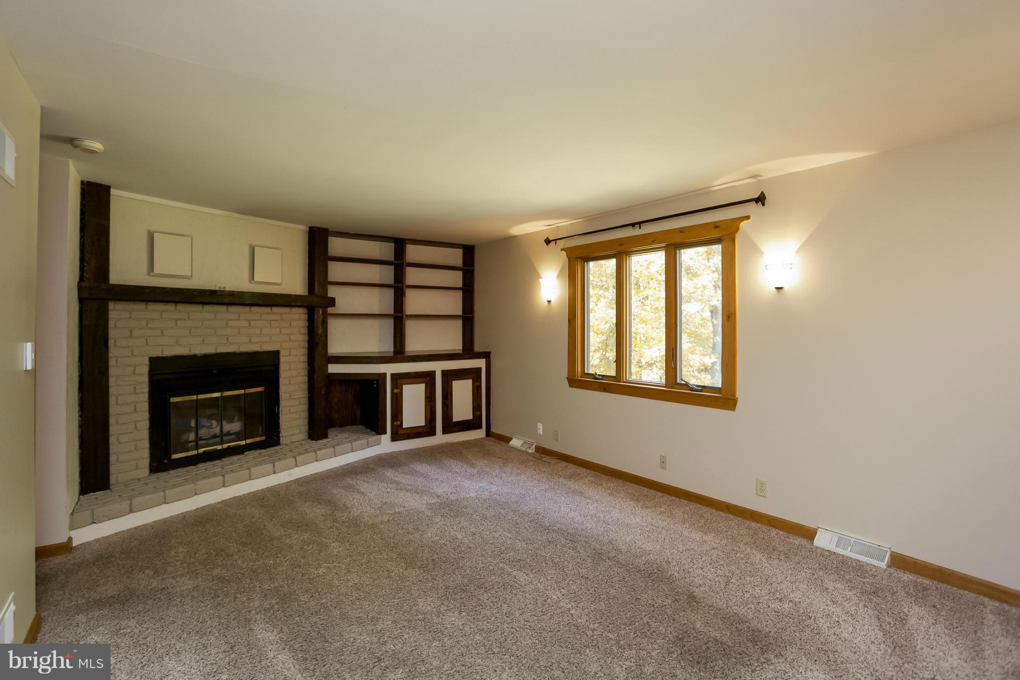 4371 Telegraph Road Elkton, MD 21921 - Photo 8 of 30 a view of a livingroom with a fireplace and window