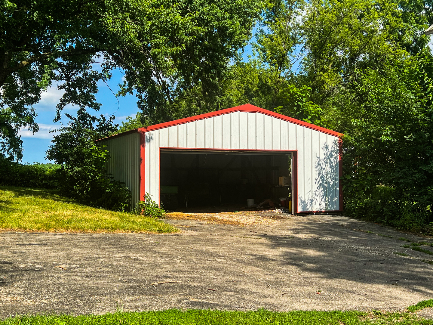 28506 Brickville Road Sycamore, IL 60178 - Photo 3 of 7 a front view of a house with yard and garage