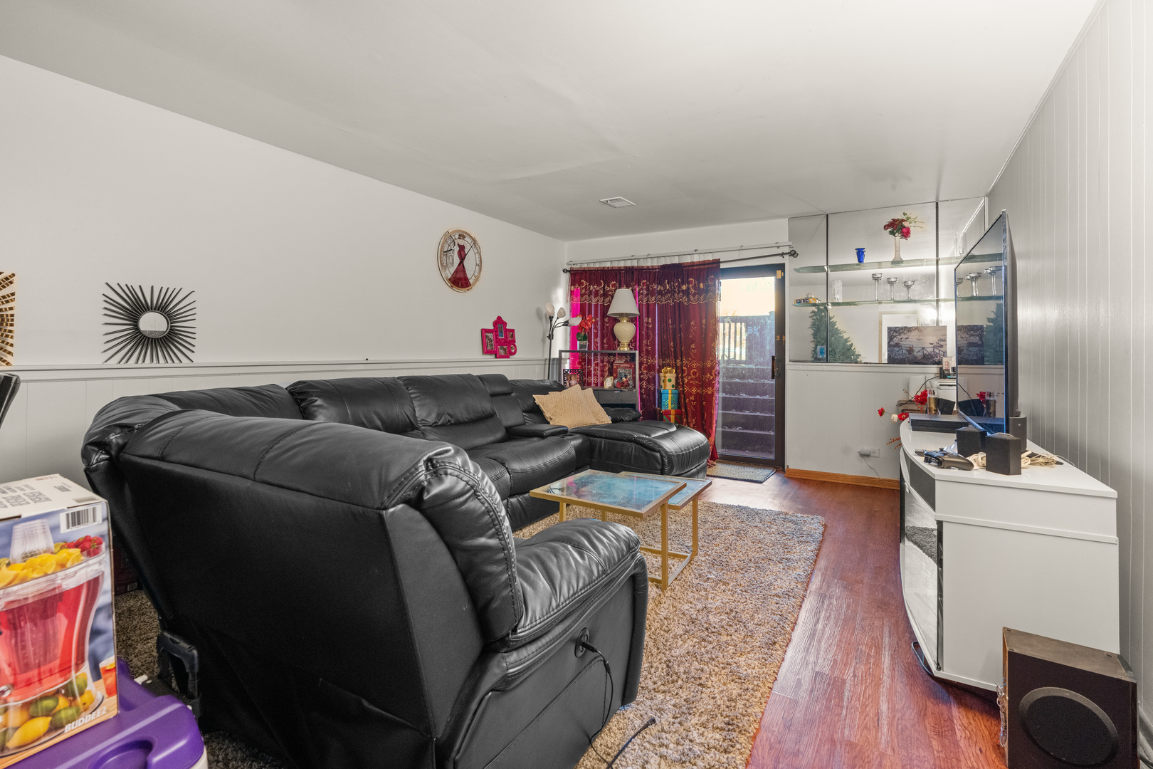 532 East Devon Avenue Roselle, IL 60172 - Photo 14 of 32 a living room with furniture and a flat screen tv