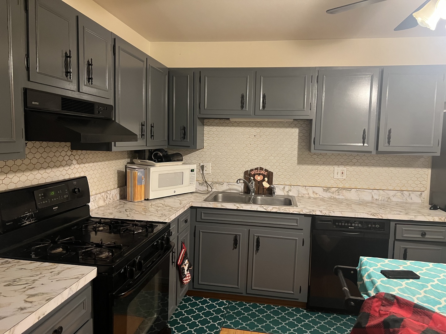 532 East Devon Avenue Roselle, IL 60172 - Photo 7 of 32 a kitchen with kitchen island granite countertop a sink a stove and cabinets