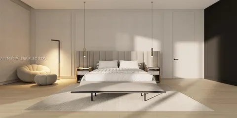 a spacious bedroom with a bed and a flat screen tv