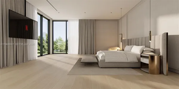 a bedroom with a bed lamps and a fireplace