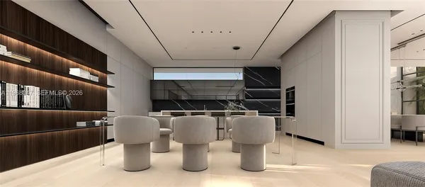 a dining room with furniture and a rug