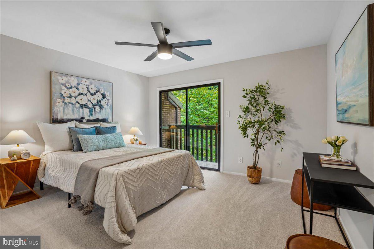 2021 Winged Foot Court Reston, VA 20191 - Photo 16 of 40 Primary suite with balcony & lighted ceiling fan