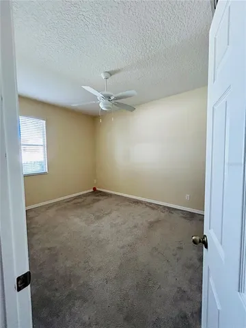 an empty room with a empty space and windows