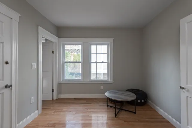 a room with a chair and a window