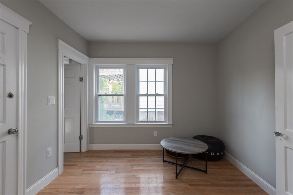 112 Brush Hill Road Milton, MA 02186 - Photo 15 of 42 a room with a chair and a window