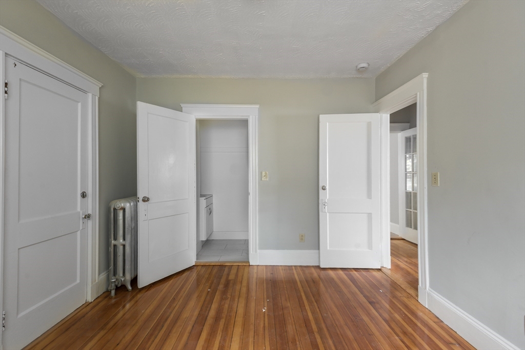 112 Brush Hill Road Milton, MA 02186 - Photo 16 of 42 wooden floor in an empty room