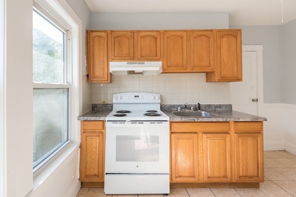 112 Brush Hill Road Milton, MA 02186 - Photo 19 of 42 a kitchen with a stove and a sink